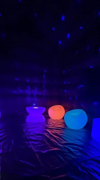LED seating under disco lights inside the tent